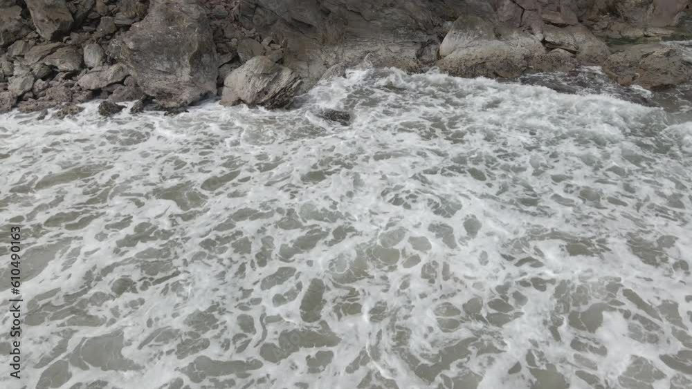 Drone aerial view. The sea collides with the stones and sand of a beach in Venezuela. Aerial view of the waves crashing on the coast. Bright ocean landscape. Sea waves, top view, wonderful natural. Drone aerial view. The sea collides with the stones and sand of a beach in Venezuela. Aerial view of the waves crashing on the coast. Bright ocean landscape. Sea waves, top view, wonderful natural.