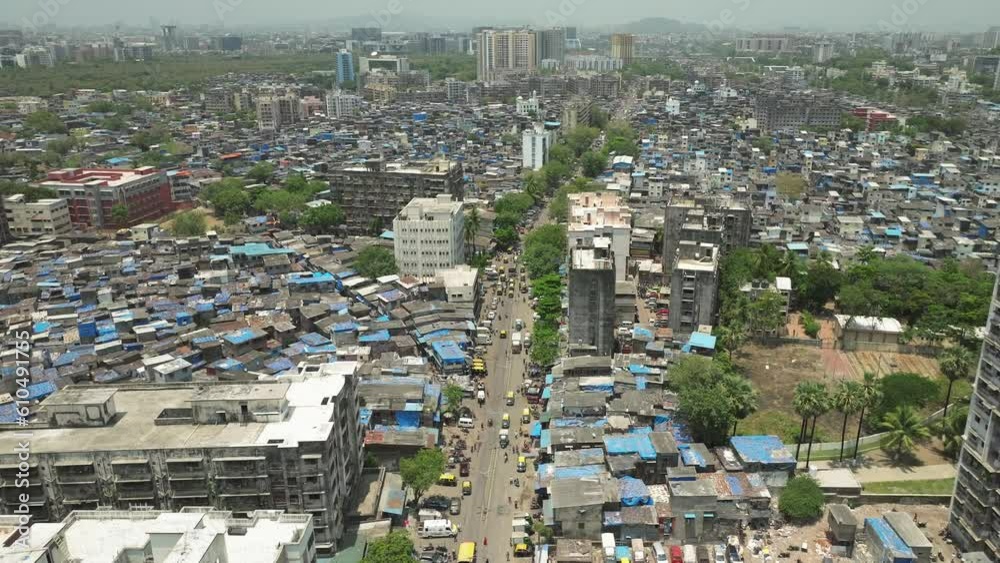Establishing shot over bustling 90 feet road in Dharavi slum in Mumbai. India Establishing shot over bustling 90 feet road in Dharavi slum in Mumbai. India