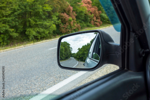 mirror, road, car, landscape, drive, vehicle, window, rear, nature, travel, view, transport, sView of the road, mountains and forest in the rear view mirror of the car.