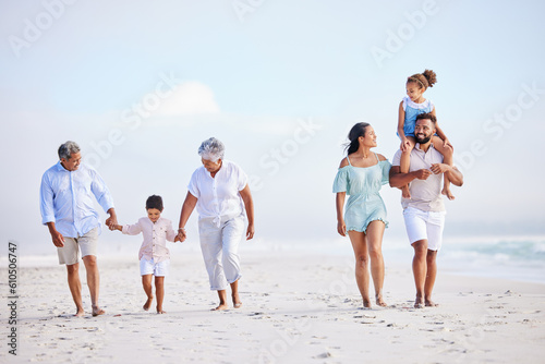 Big family, grandparents walking or kids on beach with young siblings holding hands on holiday together. Dad, mom or children love bonding, smiling or relaxing with senior grandmother or grandfather