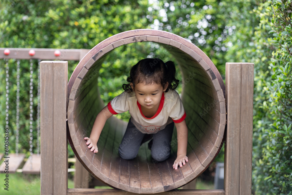 Obraz premium little child playing on a playground