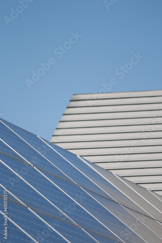 Solar panels next to house roof