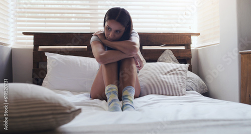 Tableau sur toile Depression, stress and woman in a bed thinking of problem, sad or mental health in her home