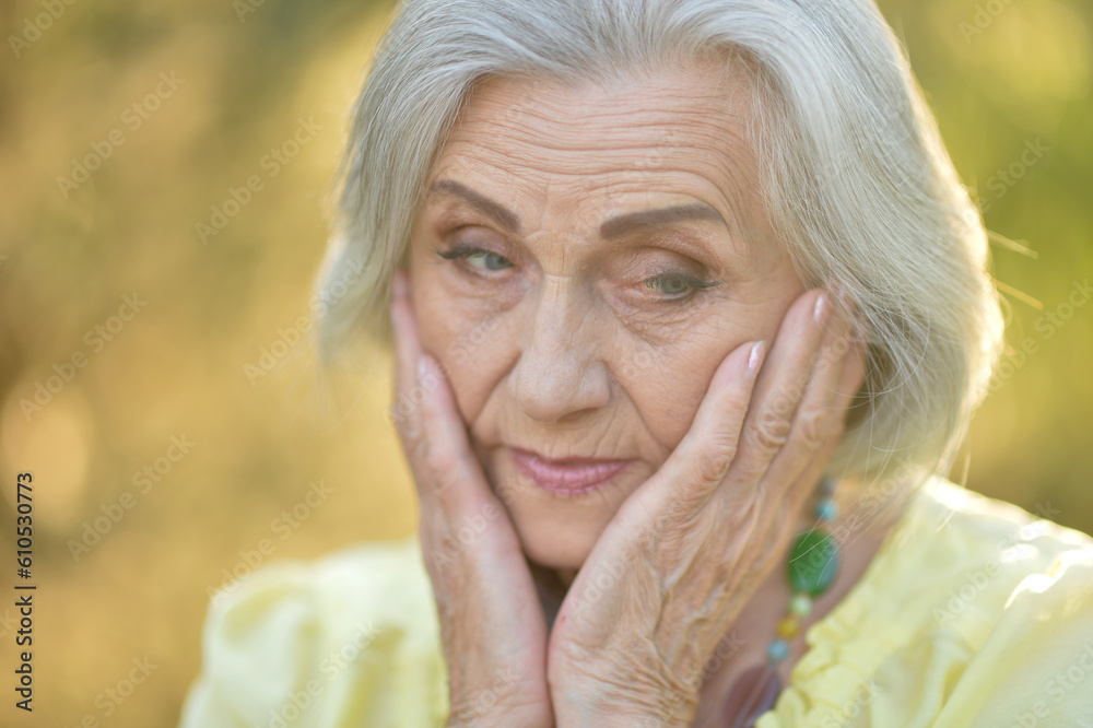 Portrait of an unhappy woman of middle age 60-75 years old with blond hair, sad eyes Portrait of an unhappy woman of middle age 60-75 years old with blond hair, sad eyes