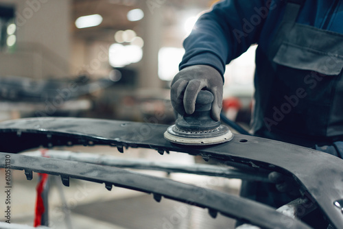 Photos Auto mechanic straightening car body in car service station