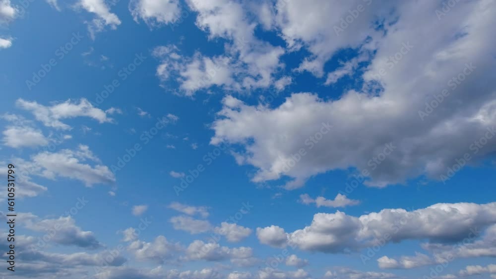 On a sunny day, white clouds gracefully traverse the expanse of the blue sky. On a sunny day, white clouds gracefully traverse the expanse of the blue sky.