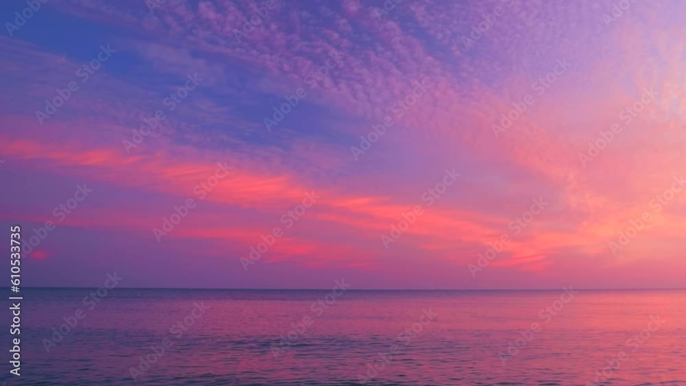 Beautiful rippled sea waves with reflection of pink sunrise light on the colors purple and yellow cloudy sky background. Calm scene, by the beach with view clouds, slow motion, hd. ProRes 422 HQ Beautiful rippled sea waves with reflection of pink sunrise light on the colors purple and yellow cloudy sky background. Calm scene, by the beach with view clouds, slow motion, hd. ProRes 422 HQ