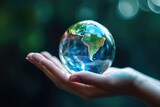 Earth Day. Hand holding crystal earth globe. Generative AI