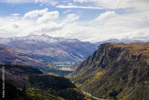Queenstown New Zealand mountain landscape view from cable car, blue sky and white clouds, autumn fall NZ © Sean