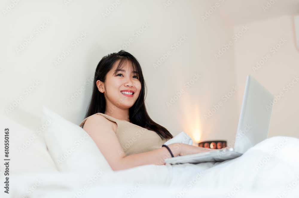 Working in bed in the morning with laptop submitting work online talk online communicate online concept of working on vacation Working in bed in the morning with laptop submitting work online talk online communicate online concept of working on vacation