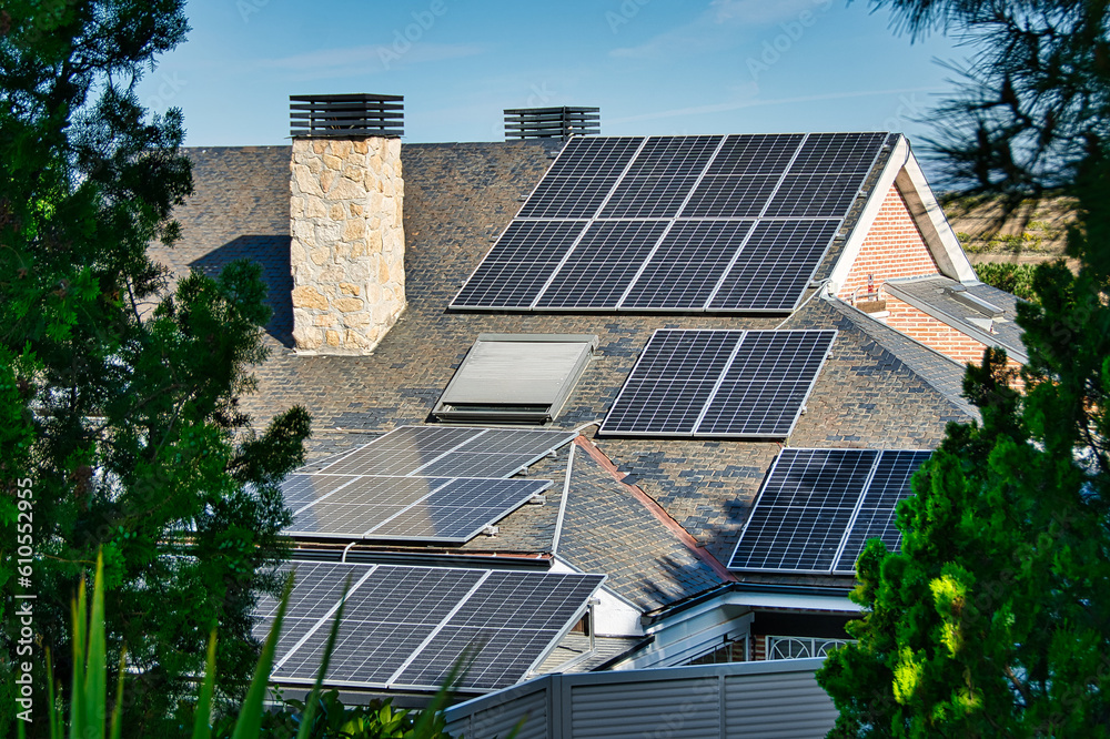 Fototapeta premium Roofs of singlefamily homes with solar energy panels