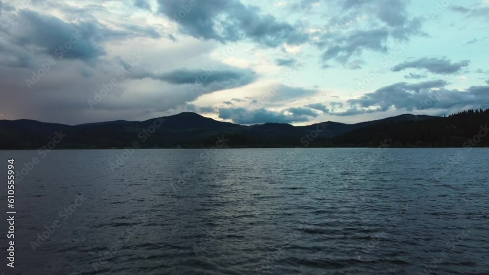 Hayden Lake With Silhouetted Mountains During Sunset In Kootenai County, Idaho, United States. Aerial Wide Shot Hayden Lake With Silhouetted Mountains During Sunset In Kootenai County, Idaho, United States. Aerial Wide Shot
