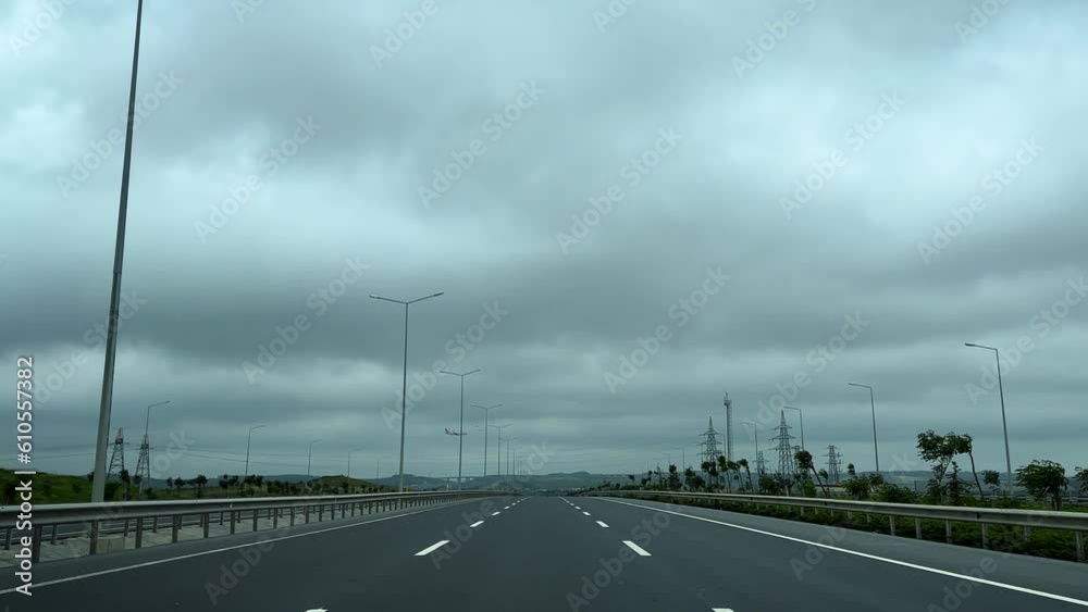 The vehicle moving on the empty highway on the airport road is suitable for compositing. The vehicle moving on the empty highway on the airport road is suitable for compositing.