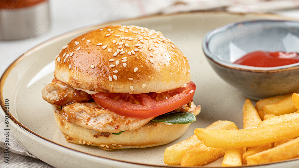 Portion of burger with french fries and ketchup Portion of burger with french fries and ketchup