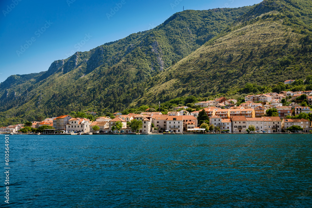 Small village with old houses on the seaside of the Bay of Kotor in Montenegro