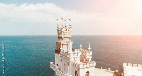 Crimea Swallow's Nest Castle on the rock over the Black Sea. It is a tourist attraction of Crimea. Amazing aerial view of the Crimea coast with the castle above abyss on sunny day. photo
