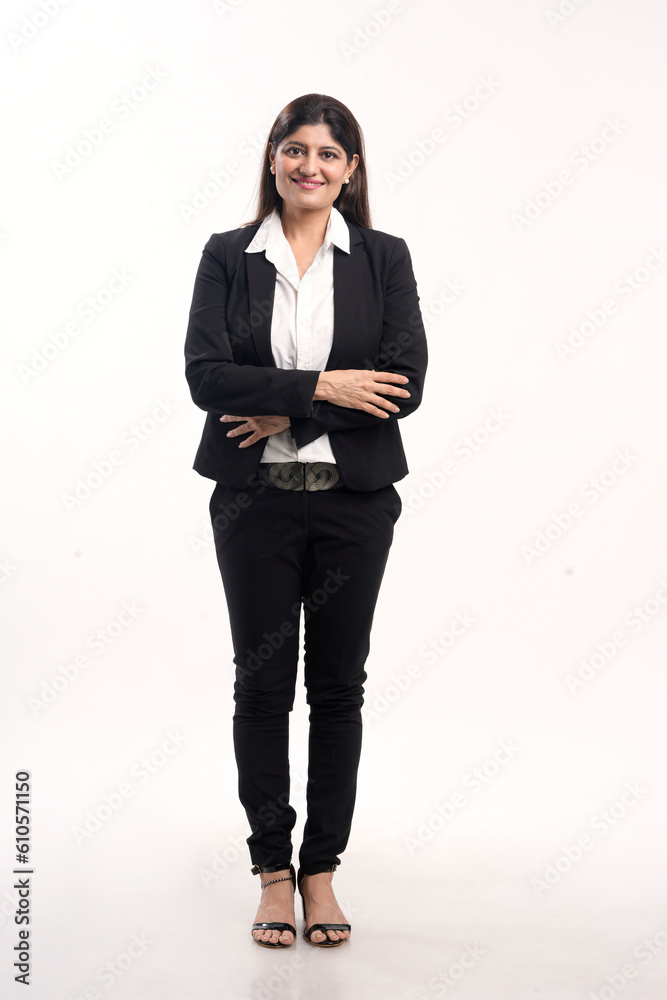 Young indian businesswoman or employee standing on white background. Young indian businesswoman or employee standing on white background.