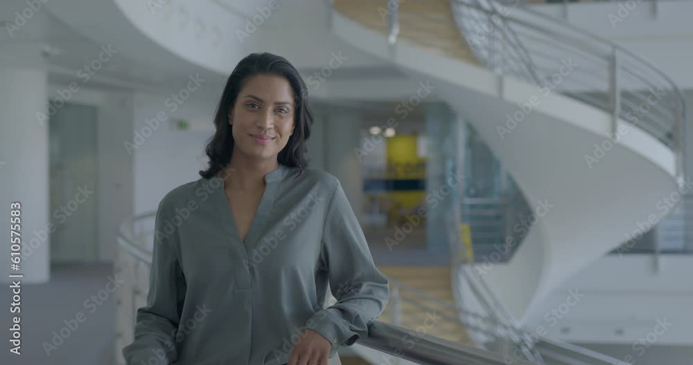 Portrait of Successful Businesswoman Standing in Office Lobby, Looking at camera Portrait of Successful Businesswoman Standing in Office Lobby, Looking at camera