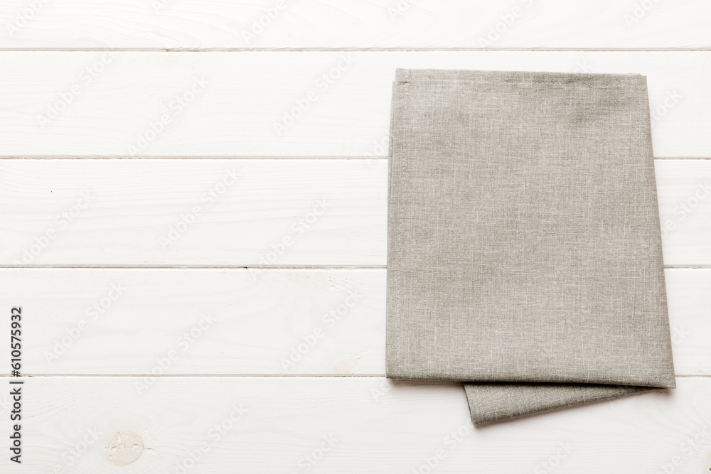 top view with gray kitchen napkin isolated on table background. Folded cloth for mockup with copy space, Flat lay. Minimal style top view with gray kitchen napkin isolated on table background. Folded cloth for mockup with copy space, Flat lay. Minimal style
