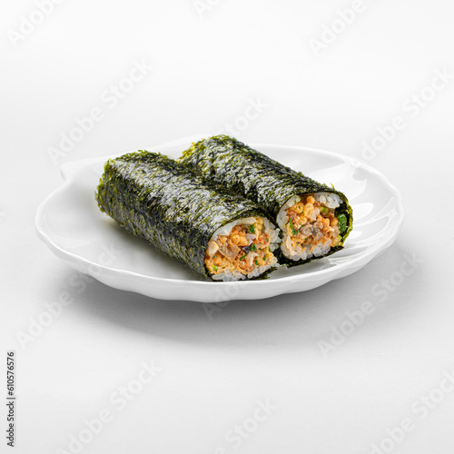 Isolated uncut unagi maki sushi rolls on white background