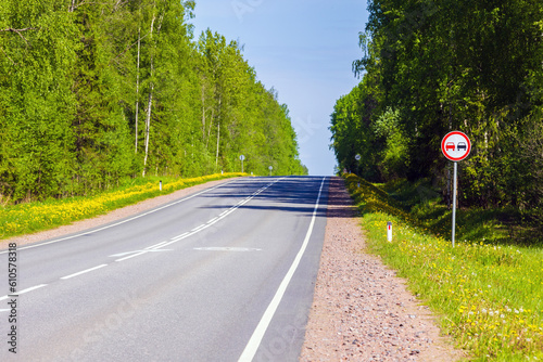 No overtaking. Road sign is on a highway roadside