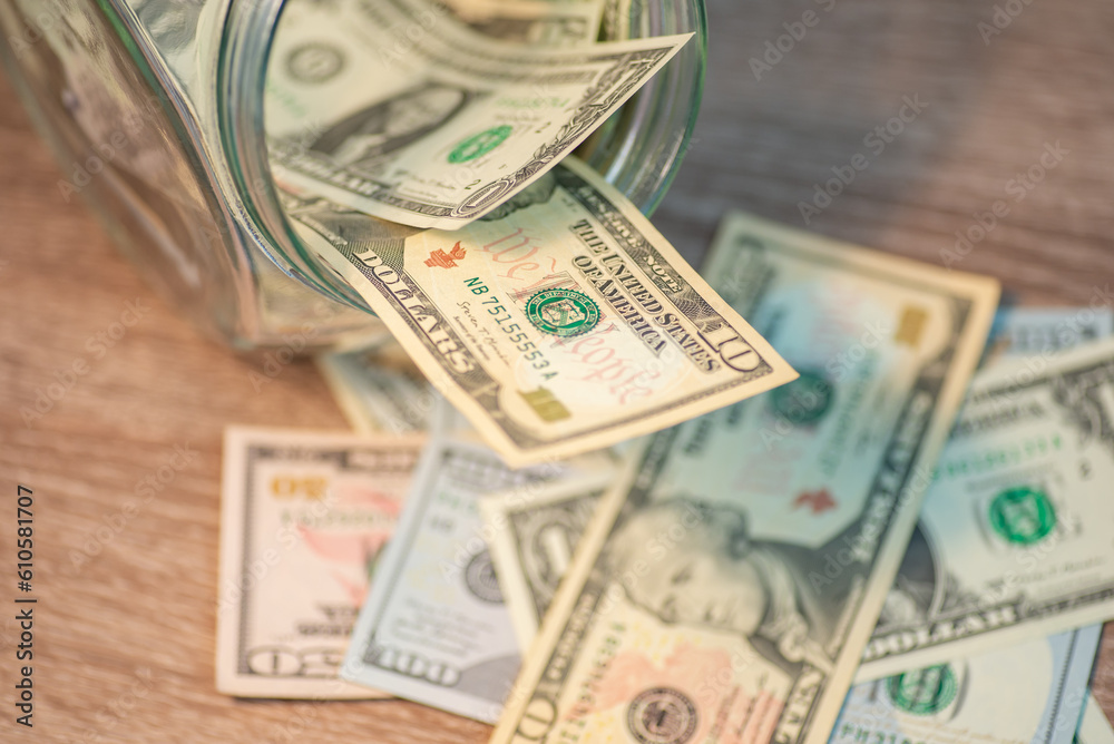 Dollar banknotes on the wooden table. Concept of money, cash, wealths, savings, payment, purchases
