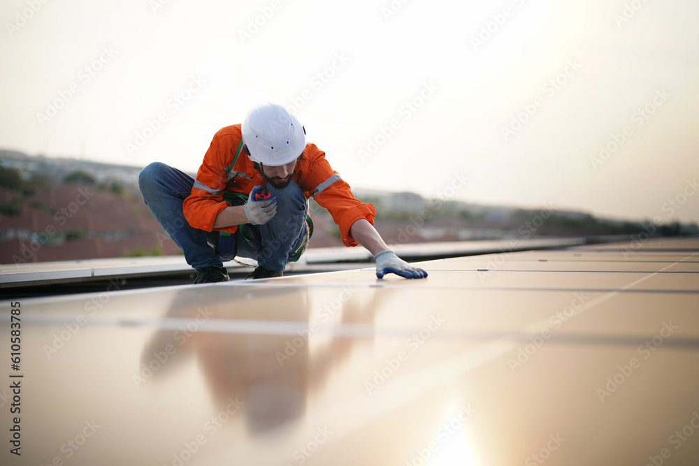 Fototapeta premium professional technician or engineer installing solar panels, Alternative energy for installed solar panels in use on roof of home