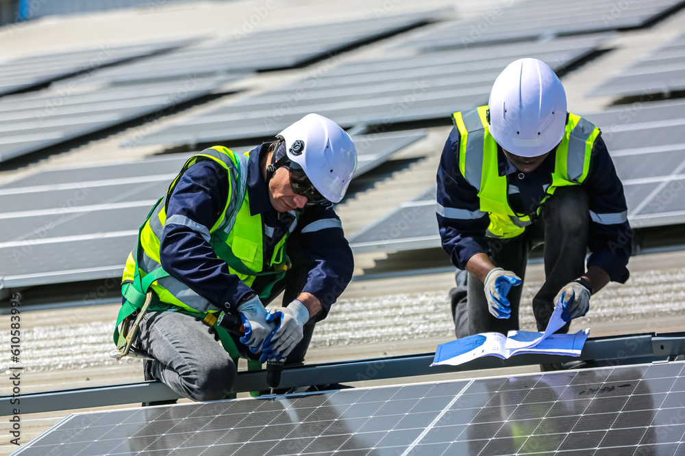 professional technician or engineer installing solar panels, Alternative energy for installed solar panels in use on roof of home professional technician or engineer installing solar panels, Alternative energy for installed solar panels in use on roof of home