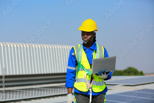 professional technician or engineer installing solar panels, Alternative energy for installed solar panels in use on roof of home