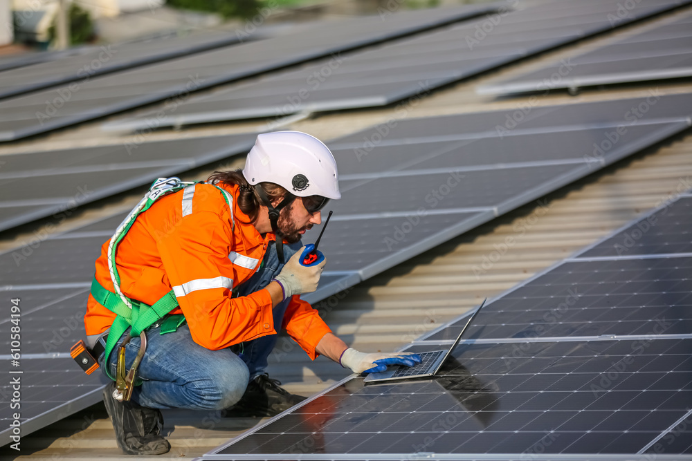 professional technician or engineer installing solar panels, Alternative energy for installed solar panels in use on roof of home professional technician or engineer installing solar panels, Alternative energy for installed solar panels in use on roof of home