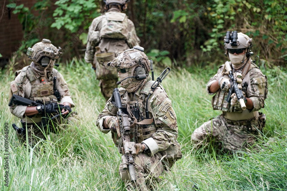 Infantry soldier shooting during military combat training.. Army elite troops marksman, special operations forces sniper wearing mask 