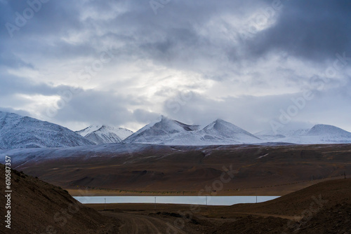 snow covered mountains, cloudy sky at the way from Moriri lake to Leh city, Ladakh, India photo