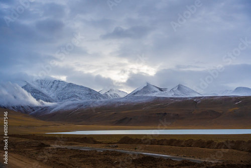 snow covered mountains, cloudy sky at Kyagar Tso, Kyagar lake with surrounding mountains, Ladakh, Inida