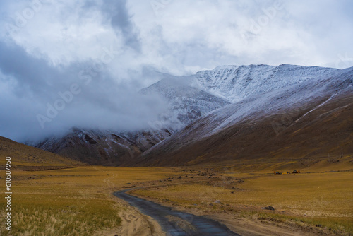 snow covered mountains, cloudy sky at the way from Moriri lake to Leh city, Ladakh, India