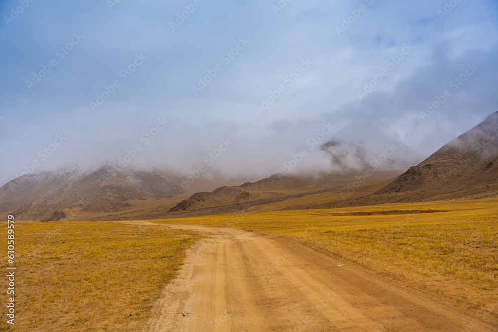  the road, mountain and cloud sky at Tanglang La pass in Ladakh, India, is the second highest motorable road in the world at 5400m