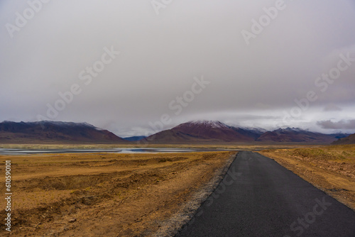  the road, mountain and cloud sky at Tanglang La pass in Ladakh, India, is the second highest motorable road in the world at 5400m photo