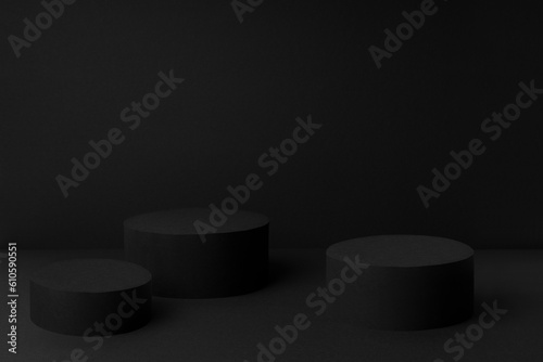 Abstract black stage with three round podiums mockup for presentation cosmetic products, goods, advertising, design in soft gradient color, in elegant rich style.
