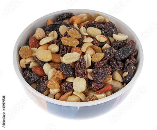 High energy trail mix with roasted nuts and fruit in a colorful bowl isolated on a white background.