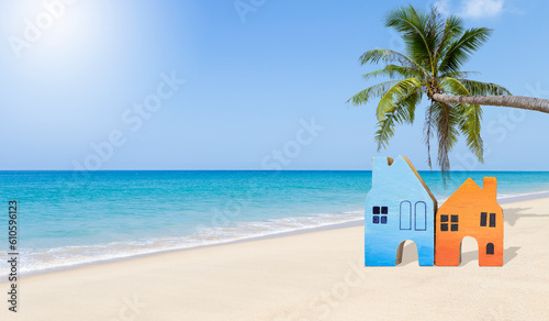 Wooden miniature house on tropical beach  summer holiday and vacation house  beach home  summer outdoor day light