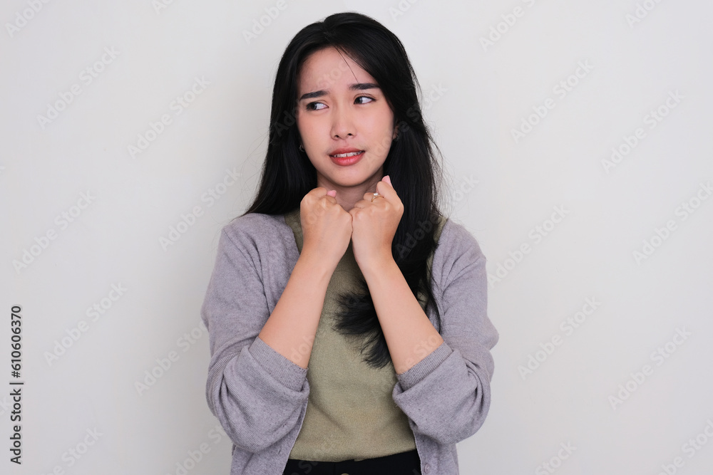 Asian young women looking to the right side showing insecure feeling Asian young women looking to the right side showing insecure feeling