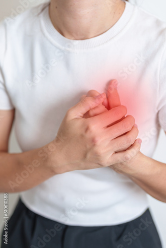 Принти на полотні Woman hand holding chest ache