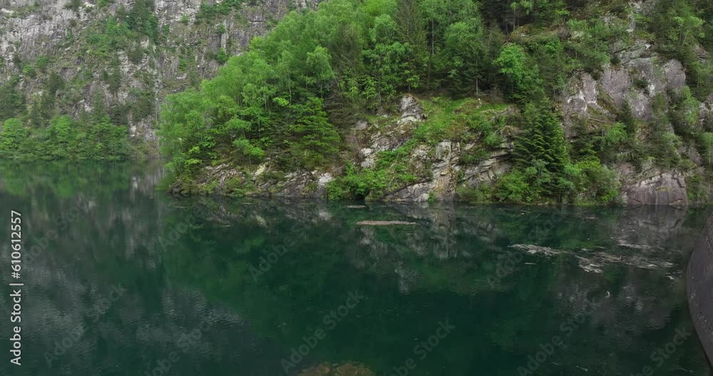 Drone flying over surface water of Malvaglia Dam in Switzerland. Aerial forward low altitude Drone flying over surface water of Malvaglia Dam in Switzerland. Aerial forward low altitude