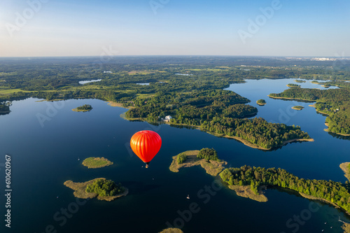 Aerial summer sunny sunset view of hot air balloon over Galve lake, Lithuania