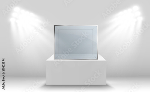 Glass showcase for the exhibition in the form of a cube. Background for sale illuminated by spotlights. Museum glass box isolated advertising or business design boutique. Exhibition hall.
