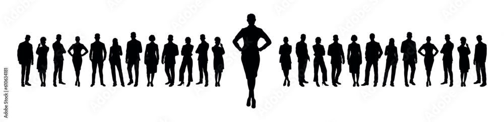 Businesswoman standing with hands on hip in front of large group of business people silhouettes.