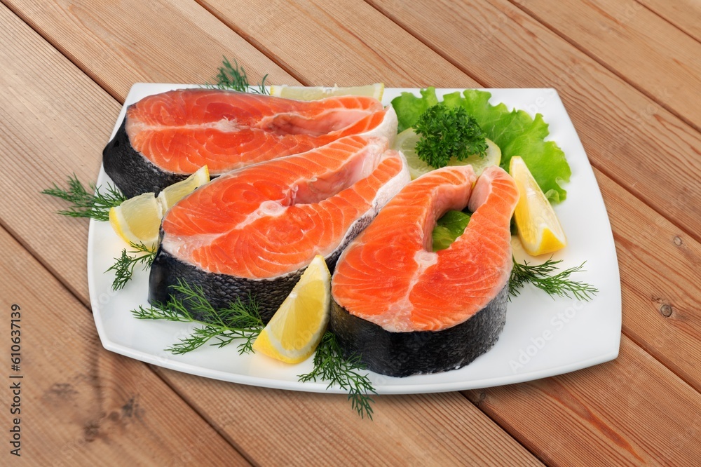 Fresh red tasty fish fillet with lemon Fresh red tasty fish fillet with lemon