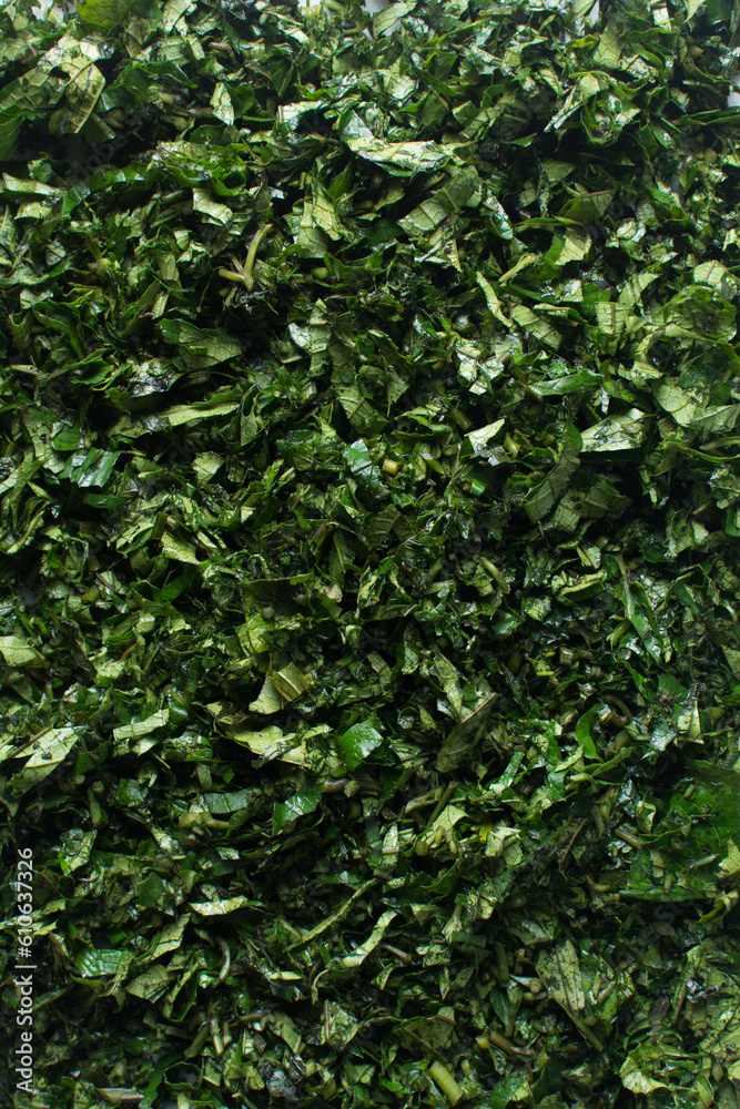 Top view of sliced pumpkin leaves, nigerian ugw leaves sliced for cooking, sliced fluted pumpkin leaves Top view of sliced pumpkin leaves, nigerian ugw leaves sliced for cooking, sliced fluted pumpkin leaves