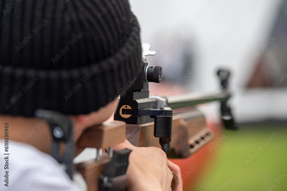 Professional precision shooter aiming at the target Professional precision shooter aiming at the target