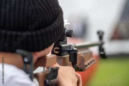 Professional precision shooter aiming at the target