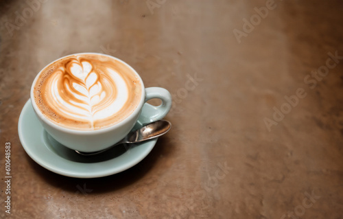 a cup of coffee and coffee beans on the wooden table in the warm cafe beside the window. coffee restaurant concept design mood. Ai illustration generator. top view copy space. wooden floor. close up